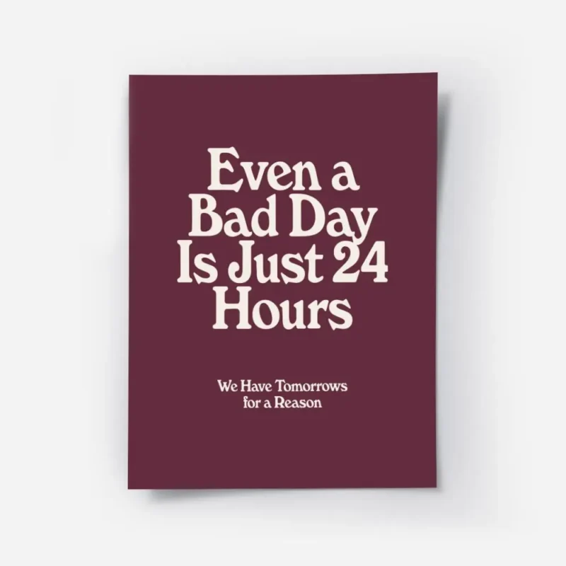 affiche bad day avec typographie blanche sur fond bordeaux presentant une citati.webp