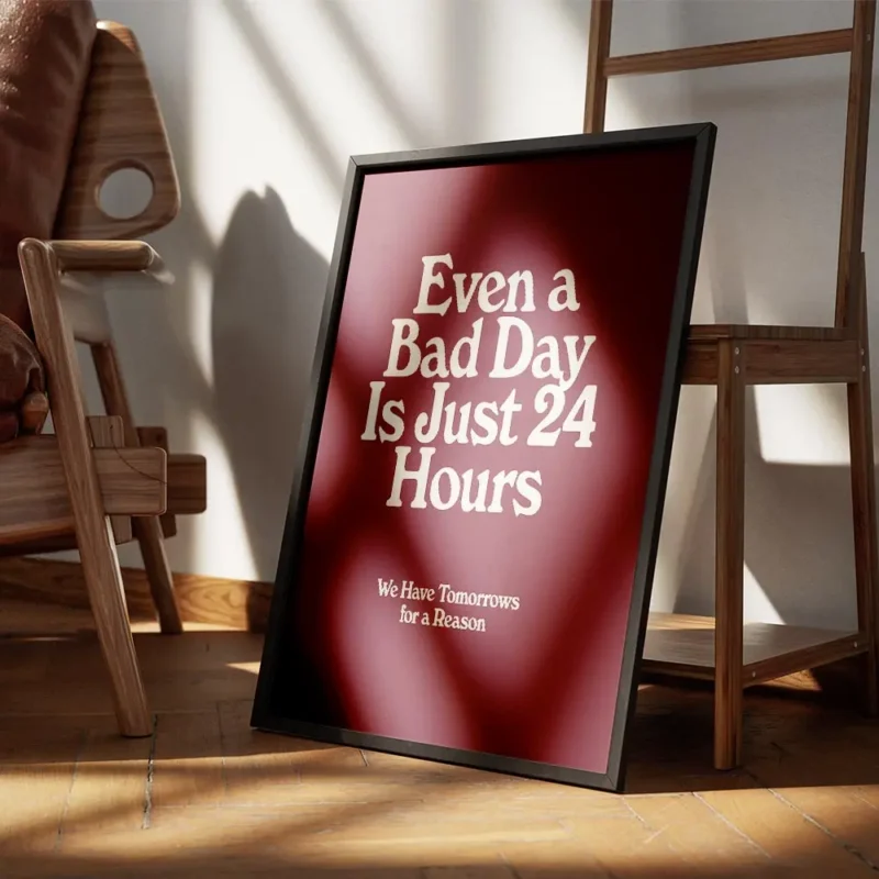 affiche bad day avec typographie blanche sur fond bordeaux presentant une citati encadre.webp