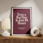 affiche bad day avec typographie blanche sur fond bordeaux presentant une citati meuble.webp