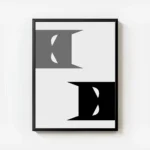 affiche batman de dc comics avec deux visages stylises en gris et noir sur fond avec cadre.webp