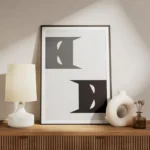 affiche batman de dc comics avec deux visages stylises en gris et noir sur fond meuble.webp