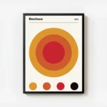 affiche bauhaus 1923 avec un grand cercle orange et rouge des cercles plus petit avec cadre.webp