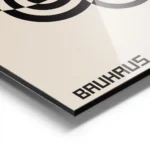 affiche bauhaus geometrique avec cercles noirs et typographie sur fond beige aluminium.webp