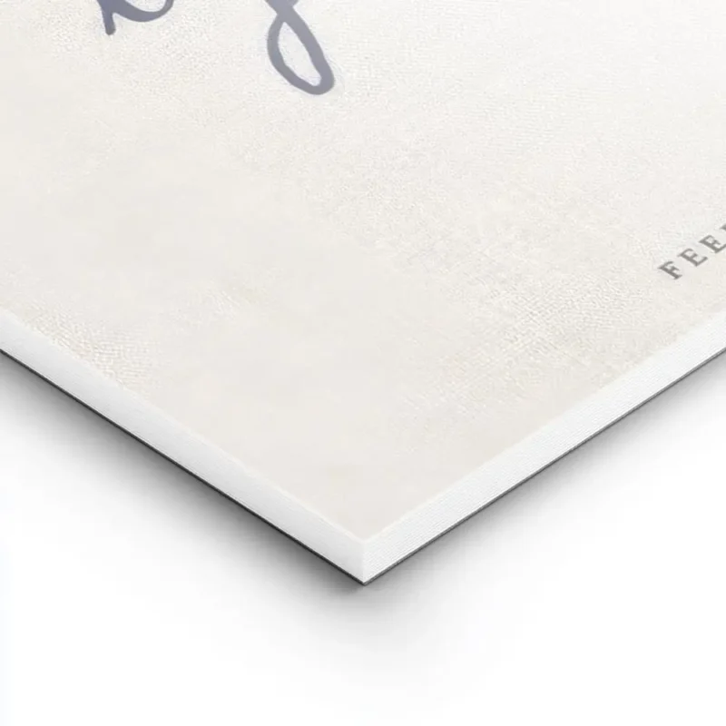 affiche beige avec le texte manuscrit slow living by the sea en bleu fonce et fe lightpanel.webp