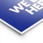 affiche bleue avec le texte embrace the chaos et we live here en blanc casse sty lightpanel.webp
