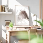 affiche blush avec un pinceau de maquillage etalant de la poudre rose sur un fon bureau.webp