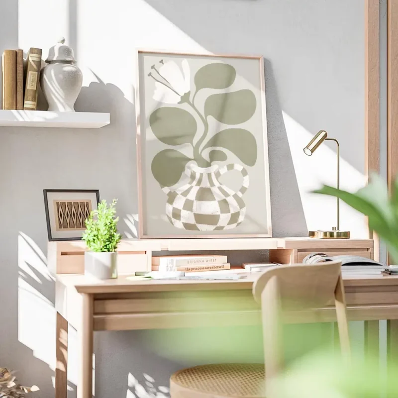 affiche bold flower une fleur blanche stylisee avec des feuilles vertes dans un bureau.webp