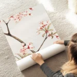 affiche botanique dun cerisier japonais branches marron et fleurs roses sur fond au sol.webp