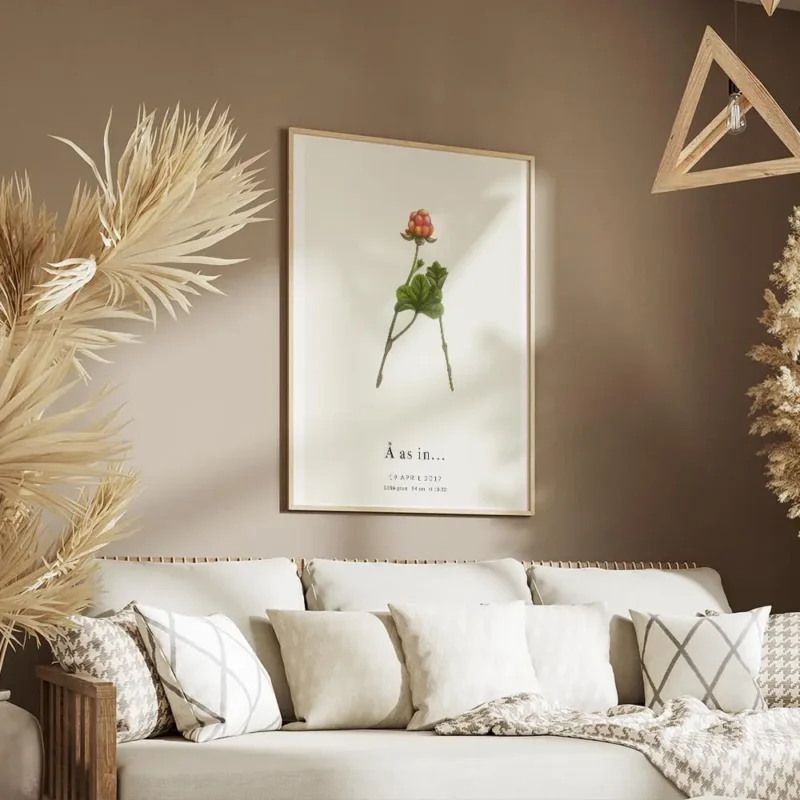affiche botanique personnalisee lettre a formee par des feuilles et une baie sur salon.webp