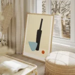 affiche bouteille noire et verre bleu avec un objet orange sur une table beige t salon beige.webp