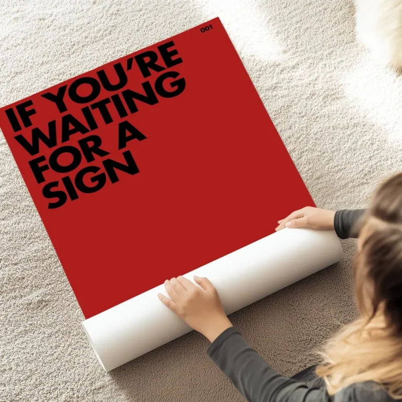 affiche citation rouge avec le texte noir if youre waiting for a sign this is it au sol.webp