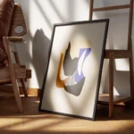 affiche collage de formes geometriques courbes aux couleurs terreuses et bleues encadre.webp