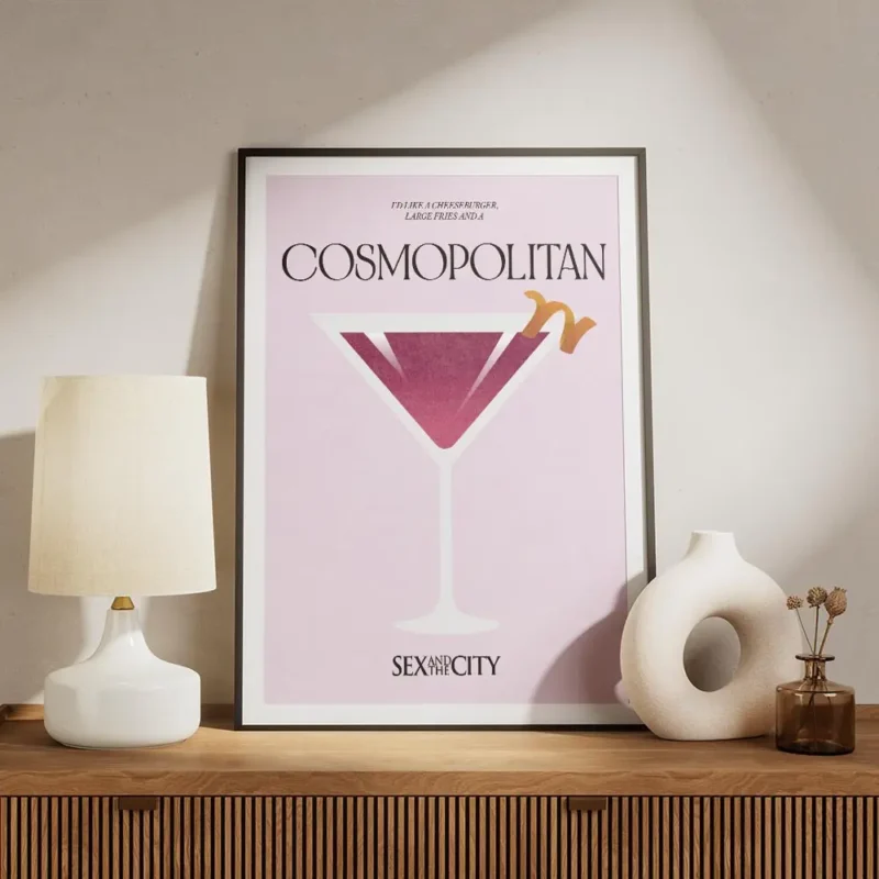 affiche cosmopolitan rose clair avec un verre a cocktail et une ecorce dorange t meuble.webp