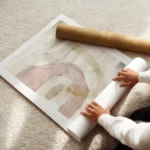 affiche dart abstrait aquarelle aerienne aux formes douces roses beiges et bleue enroule.webp