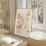 affiche dart abstrait aquarelle aerienne aux formes douces roses beiges et bleue salon beige.webp