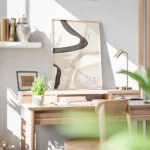 affiche dart abstrait avec des formes texturees noires beiges et blanches et des bureau.webp