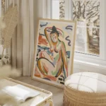 affiche dart abstrait colore dune femme assise au bord de la riviere avec des tr salon beige.webp