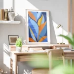 affiche dart abstrait moderne avec des feuilles stylisees bleues oranges et jaun bureau.webp