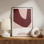 affiche dart abstrait moderne avec des formes asymetriques bordeaux rose clair e meuble.webp