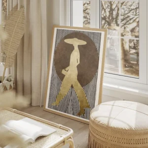 affiche dart graphique silhouette doree dune femme avec chapeau sur fond de pois salon beige.webp