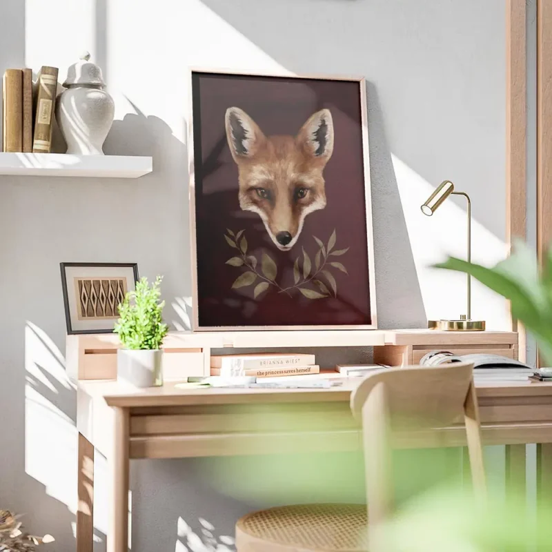 affiche dart renard avec typographie de tete de renard orange et noire sur fond bureau.webp