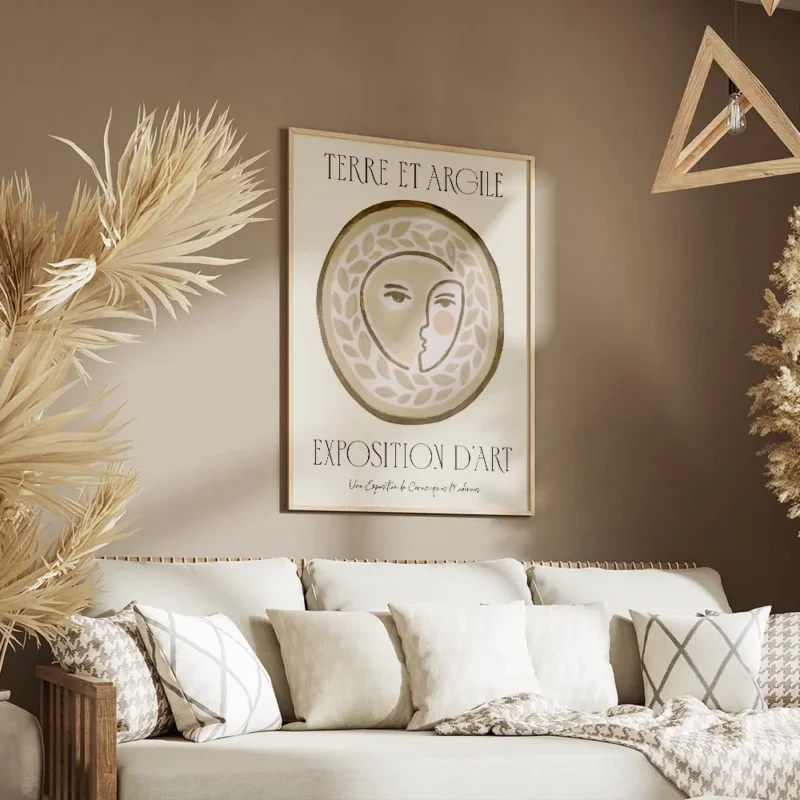 affiche dart terre et argile visage humain stylise dans un cercle avec motifs de salon.webp
