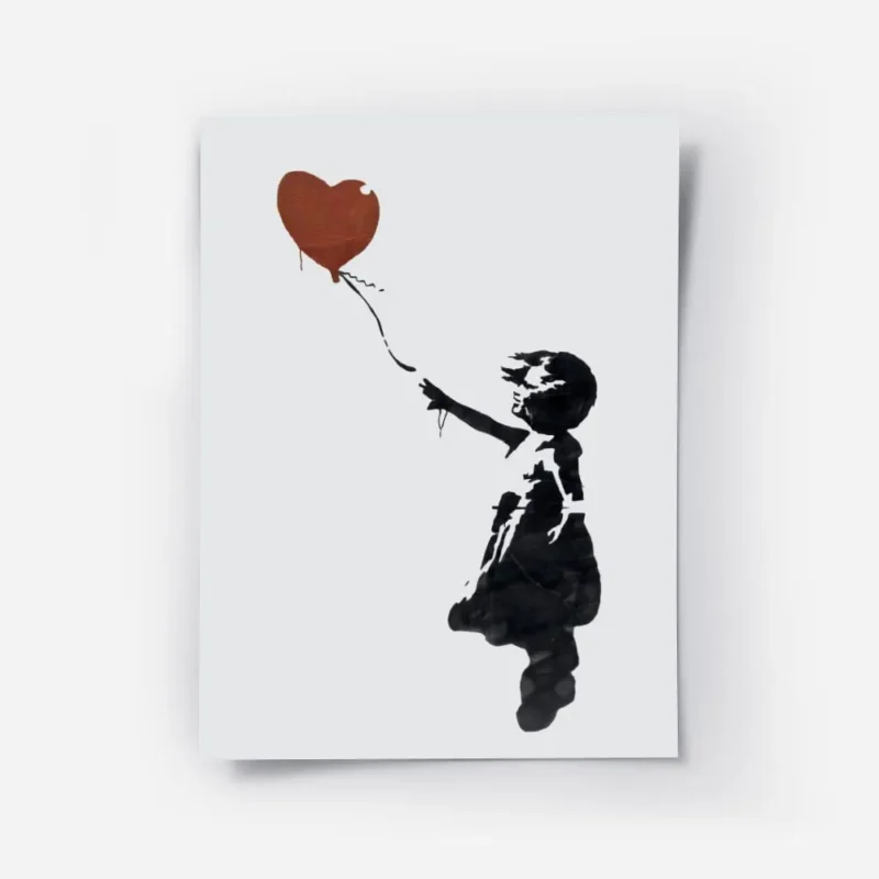 affiche de banksy fillette en noir tendant la main vers un ballon coeur rouge su.webp