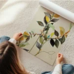 affiche de branches et de feuilles vertes jaunes et marron sur fond beige typogr en rouleau.webp