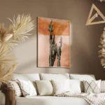 affiche de cactus vert fonce devant un mur couleur terre cuite rosee salon.webp