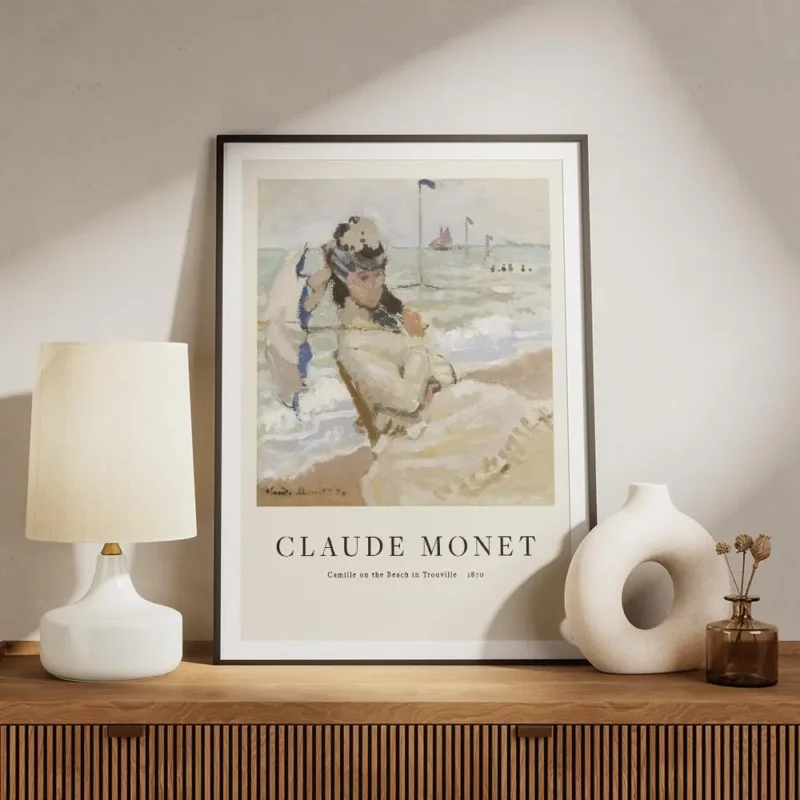 affiche de camille sur la plage de trouville par monet une femme assise tenant u meuble.webp