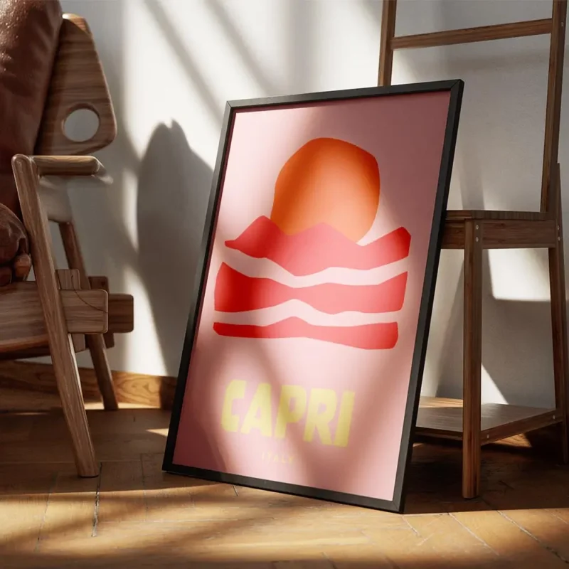 affiche de capri aux couleurs vives avec un soleil orange des montagnes roses et encadre.webp