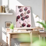 affiche de cerises rouges stylisees avec des ombres sur un fond rose uni dessin bureau.webp