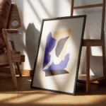 affiche de collage avec formes geometriques angulaires superposees en orange noi encadre.webp