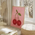 affiche de deux cerises rouges avec des queues vertes et des feuilles sur fond r salon beige.webp