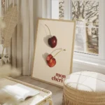 affiche de deux cerises rouges sur fond clair lune entiere et lautre coupee en d salon beige.webp
