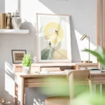 affiche de deux cygnes stylises en beige et vert avec un soleil jaune sur fond g bureau.webp
