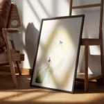 affiche de deux cygnes stylises en beige et vert avec un soleil jaune sur fond g encadre.webp