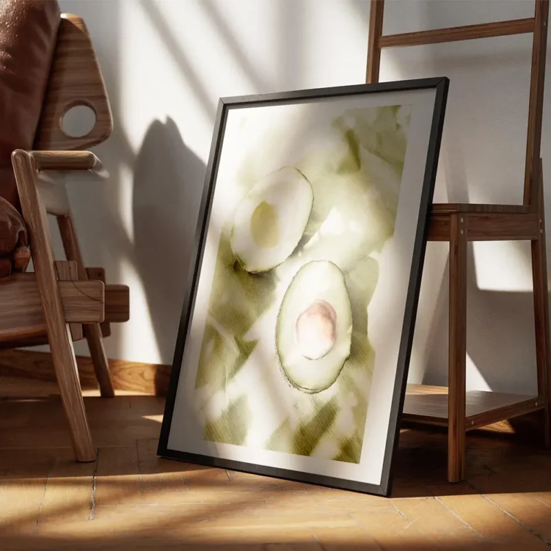 affiche de deux moities davocat sur papier vert avec des ombres creant des motif encadre.webp