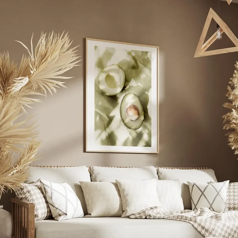 affiche de deux moities davocat sur papier vert avec des ombres creant des motif salon.webp