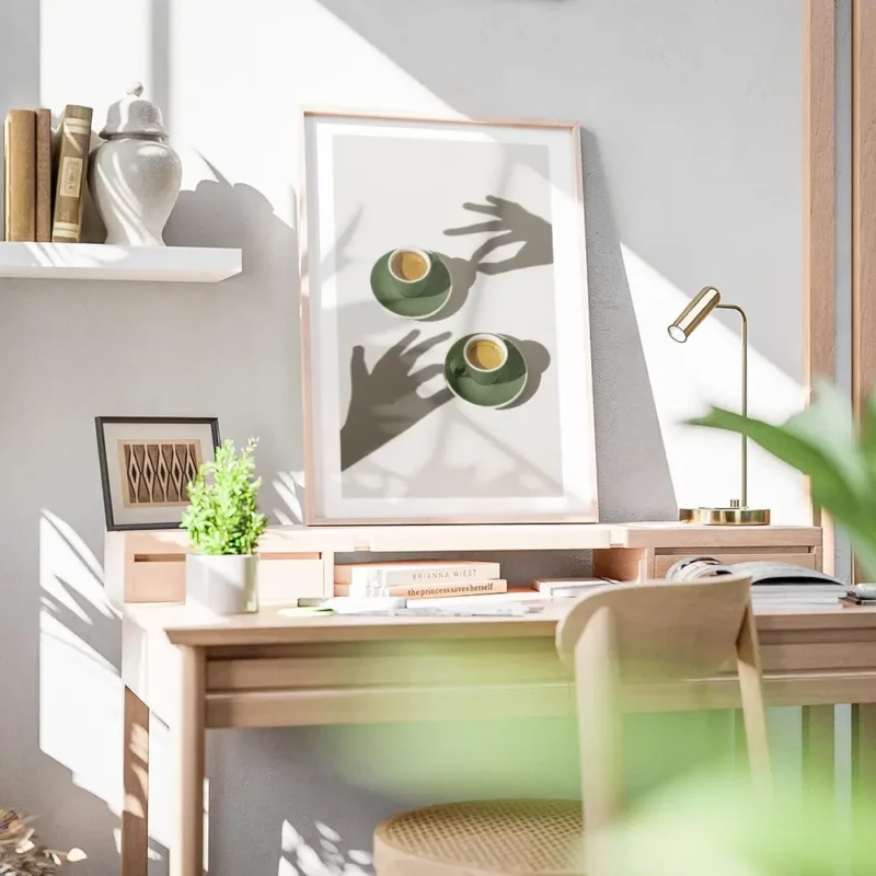 affiche de deux tasses de cafe vert sur soucoupes avec des ombres de mains sur l bureau.webp