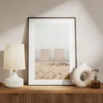 affiche de deux transats rayes beige et blanc sur une plage de sable ocean azur meuble.webp