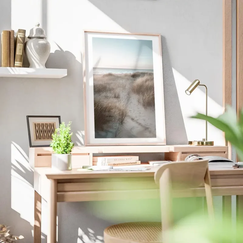 affiche de dunes de sable avec herbe de plage et ocean calme au coucher du solei bureau.webp