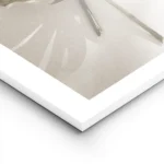 affiche de feuilles de monstera une verte et une doree posees sur un fond clair lightpanel.webp