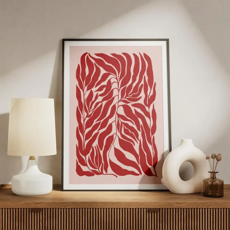 affiche de feuilles rouges sur fond rose motif graphique meuble.webp