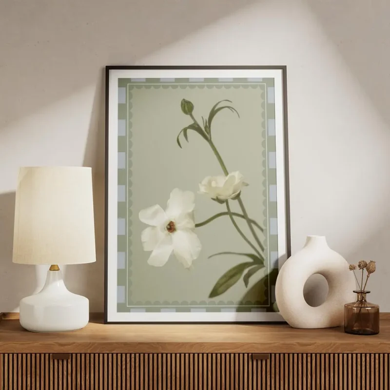 affiche de fleurs blanches sur fond vert doux aux petales delicats et a la typog meuble.webp
