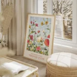 affiche de fleurs colorees en jaune rouge et rose sur fond bleu avec typographie salon beige.webp